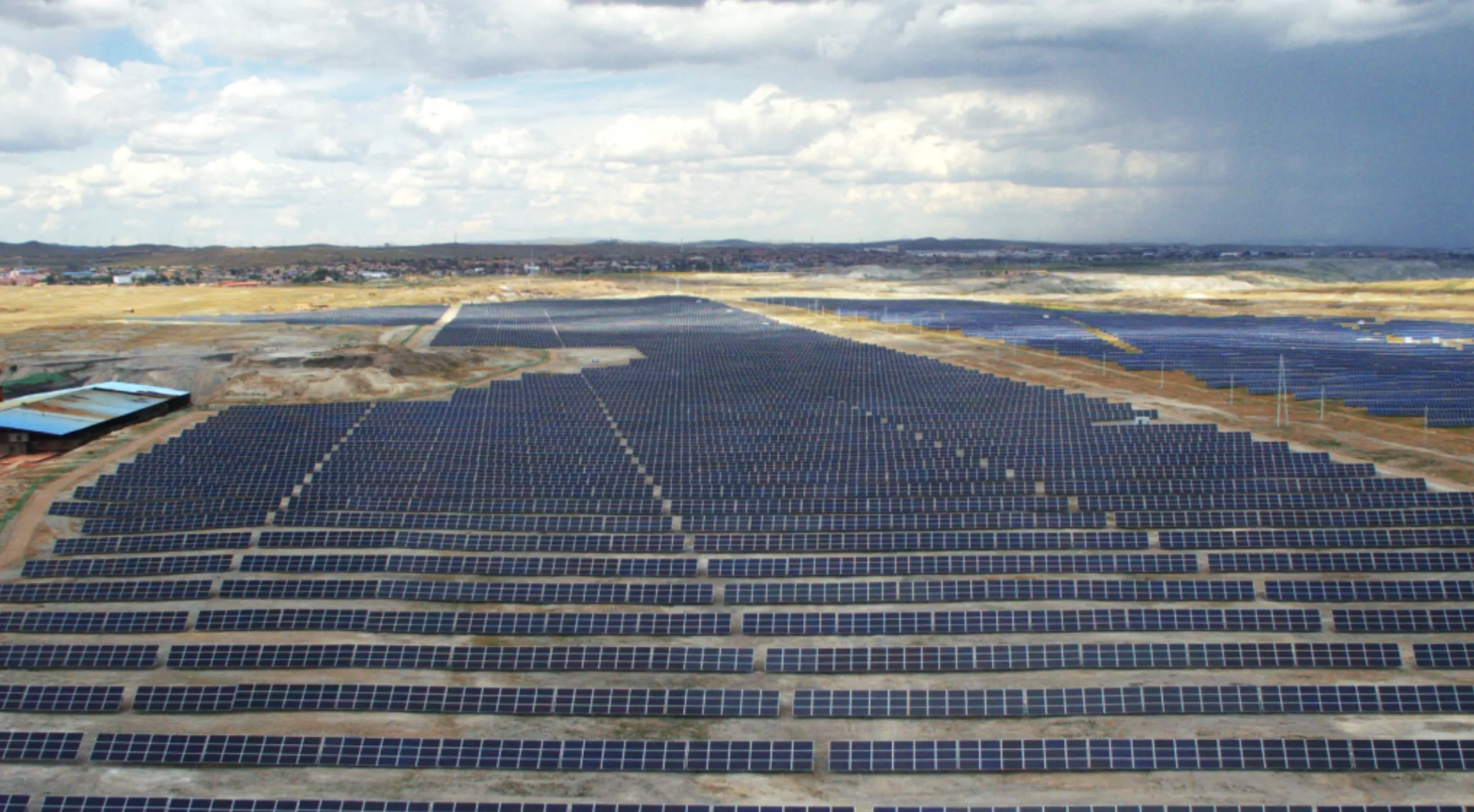 Utility scale solar field representing project developer partner role