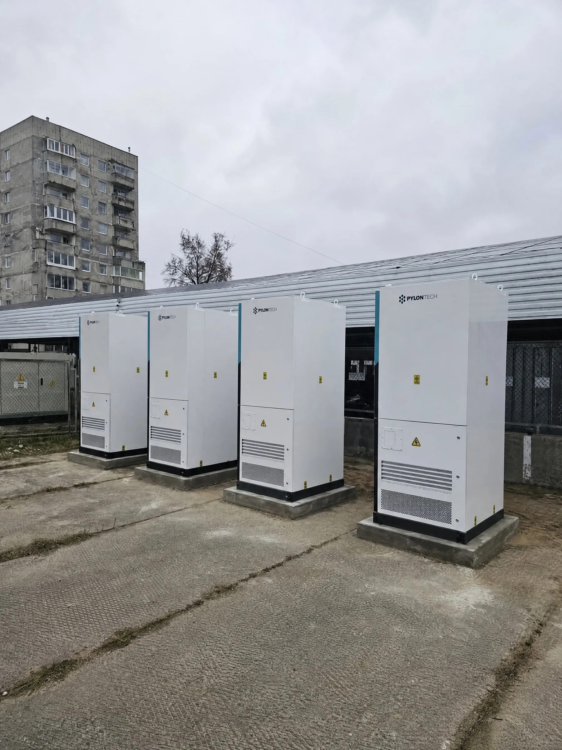 Outdoor liquid-cooled Pylontech cabinets on a commercial yard